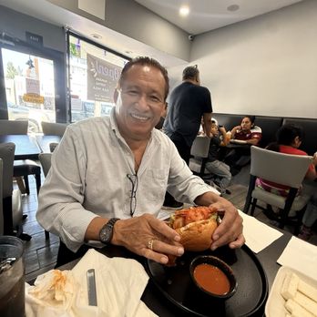 Ninas Kitchen - Happy customer with his pan con pollo ! - Salvadoran Near Me - San Fernando Valley, California