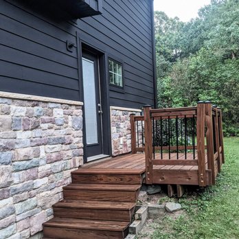 Roell Painting - a front porch with steps leading up to a house - Painters Near Me - Minneapolis, Minnesota