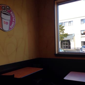 Dunkin' - a view of a coffee shop through a window - Donuts Near Me - Portsmouth, New Hampshire Dunkin' - a view of a coffee shop through a window - Donuts Near Me - Portsmouth, New Hampshire