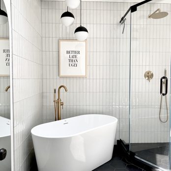 Bodega Style - Total Look porcelain wall tile and black hex porcelain floor tile.  The bathroom remodel that was saved by Joanna. - Building Supplies Near Me - Anaheim, California