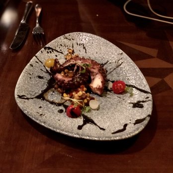Tiffins Restaurant - Charred Octopus with Grilled Corn Salsa, Tequila, Mole Negro, Pickles, Cilantro - New American Near Me - Lake Buena Vista, Florida Tiffins Restaurant - Charred Octopus with Grilled Corn Salsa, Tequila, Mole Negro, Pickles, Cilantro - New American Near Me - Lake Buena Vista, Florida