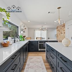 LFM Construction & Remodeling - Immerse yourself in the timeless contrast of elegance and depth showcased in our captivating kitchen overview.
