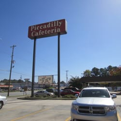 Storefront sign on Cobb Parkway, just south of South Marietta Parkway intersection.