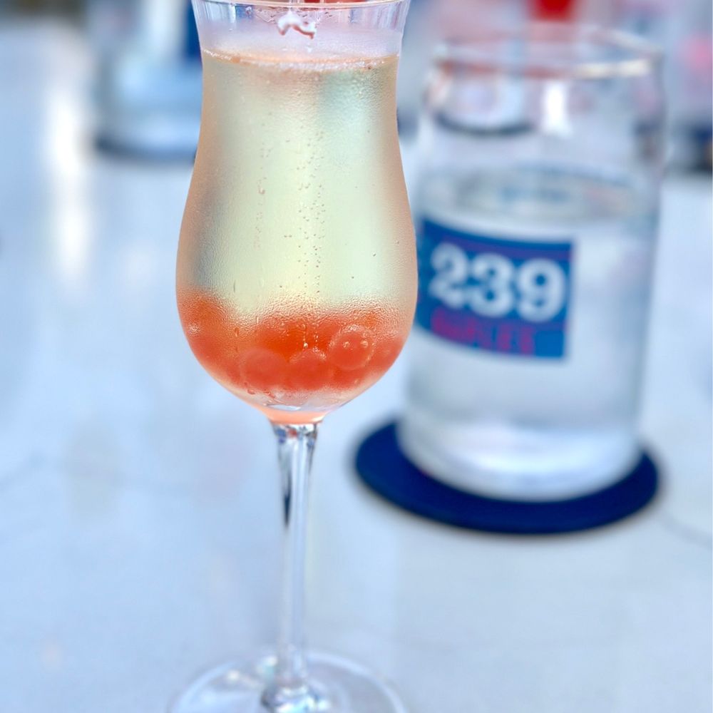 The 239 Naples - a close up of a glass of wine - American Near Me - Naples, Florida