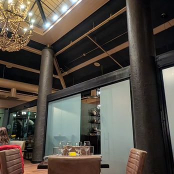 Tupelo Park City - Chandelier and pointing towards the bar - New American Near Me - Park City, Utah