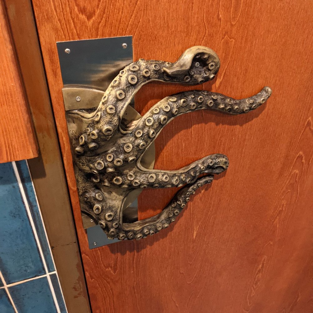 Tiki Docks Riverview - Octopus door handle in both men's and women's bathrooms - Salad Near Me - Riverview, Florida Tiki Docks Riverview - Octopus door handle in both men's and women's bathrooms - Salad Near Me - Riverview, Florida