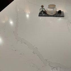 TGM Turquoise Granite & Marble - Beautiful Quartz install. What isn't pictured is how beautiful they did with the seam in the back left corner of the counter top.
