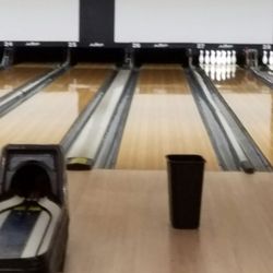 Arc Rocklin Bowl - Trash can catching water from leaking roof and broken lanes.