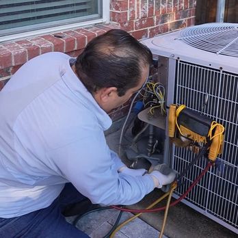 The Go 2 Guys Heating & Air - Go2guy HVAC tech inspecting condenser - Heating & Air Conditioning/HVAC Near Me - Irving, Texas The Go 2 Guys Heating & Air - Go2guy HVAC tech inspecting condenser - Heating & Air Conditioning/HVAC Near Me - Irving, Texas