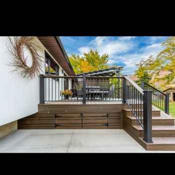 R&D Builders - Composite deck with black metal handrail, deck skirting, and double door - Decks & Railing Near Me - Clearfield, Utah