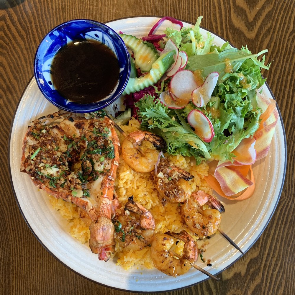 Wooden Fish - Grilled Lobster & Shrimp Skewers on a bed of Saffron Butter rice and salad. - Vietnamese Near Me - West Vancouver, British Columbia Wooden Fish - Grilled Lobster & Shrimp Skewers on a bed of Saffron Butter rice and salad. - Vietnamese Near Me - West Vancouver, British Columbia