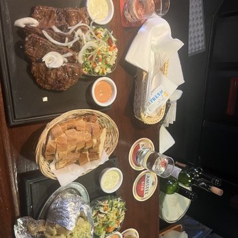 Café De Klos - Shared plate of lamb chops, baked potato, two salads, sauces and fresh bread! Delicious! - Barbeque Near Me - Amsterdam, New Hampshire