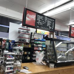 Athena Grocery - Some of the menu, hot case, and counter.