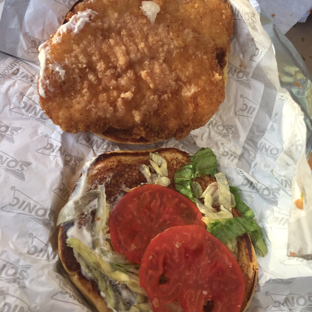 Sonic Drive-In - Does this look like an "ULTIMATE chicken sandwich"? Look at the tomatoes, you have got to be kidding me. I felt I was being pranked. - Burgers Near Me - Hialeah Gardens, Florida Sonic Drive-In - Does this look like an "ULTIMATE chicken sandwich"? Look at the tomatoes, you have got to be kidding me. I felt I was being pranked. - Burgers Near Me - Hialeah Gardens, Florida