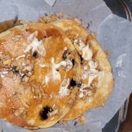Blueberry pancake with butter and granola