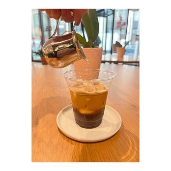 Cafe Gonzalez - a person pouring coffee into a cup - Coffee & Tea Near Me - New York, New York