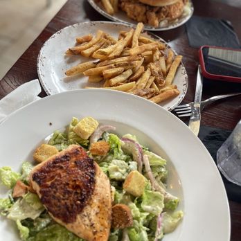 Wolfies Grill - Geist - Cesar salad with salmon, fries, Nashville hot chicken. - American Near Me - Indianapolis, Indiana Wolfies Grill - Geist - Cesar salad with salmon, fries, Nashville hot chicken. - American Near Me - Indianapolis, Indiana