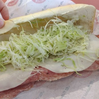 Jimmy John's - a hand holding a sub sandwich - Sandwiches Near Me - Harlingen, Texas