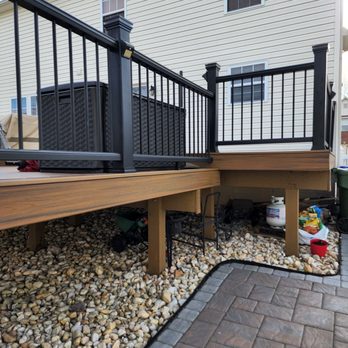 Strong Wall Construction - a deck with black railings - General Contractors Near Me - Baltimore, Maryland