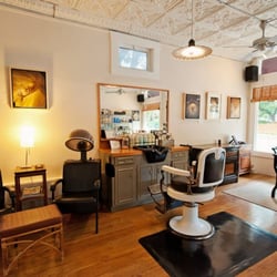 Our entire salon is sunlit, totally relaxing as soon as you walk in. Here is a picture of our old-school barber chairs we use.