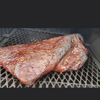 Iceman’s BBQ - two steaks on a grill - Barbeque Near Me