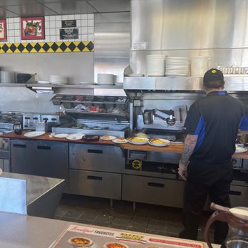 Waffle House - a man preparing food in the kitchen - Diners Near Me - Bowling Green, Kentucky Waffle House - a man preparing food in the kitchen - Diners Near Me - Bowling Green, Kentucky