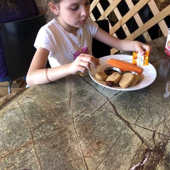 Ginger's Garden Cafe - My baby enjoying her nuggets. - Live/Raw Food Near Me - Springville, Utah