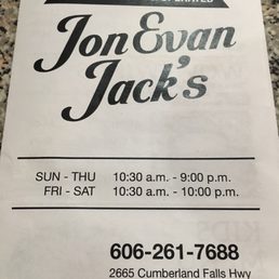 Front of menu with address, phone number and hours.