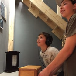 Mystery NH Escape Rooms - Players listening to a secret message.