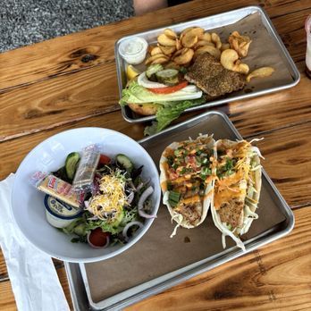 Salty Pearl Raw Bar - Top: grilled grouper sandwich with yummy fries. Bottom: grilled grouper tacos with side salad. - Seafood Near Me - Pensacola, Florida