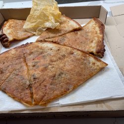 Zoner's Pizza - Underside of pizza saturated in grease.