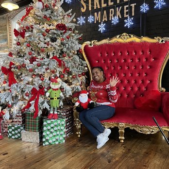 Streetside Market - a woman sitting on a red chair in front of a christmas tree - Asian Fusion Near Me - Hammond, Louisiana Streetside Market - a woman sitting on a red chair in front of a christmas tree - Asian Fusion Near Me - Hammond, Louisiana