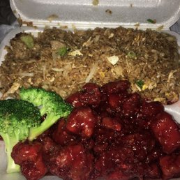 a container of food with broccoli a container of food with broccoli