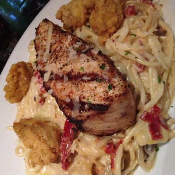 Tope La - Amberjack with Alfredo, artichoke and sundried tomatoes. - Bars Near Me - Hammond, Louisiana Tope La - Amberjack with Alfredo, artichoke and sundried tomatoes. - Bars Near Me - Hammond, Louisiana