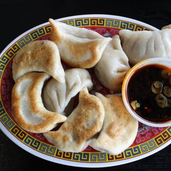 Lucky Kitchen - a plate of dumplings and dipping sauce - Chinese Near Me - Ann Arbor, Michigan Lucky Kitchen - a plate of dumplings and dipping sauce - Chinese Near Me - Ann Arbor, Michigan