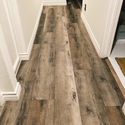 Hallway floor with transition into tiled bathroom floor
