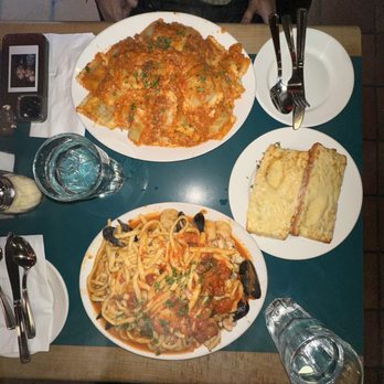 Anton's Pasta Bar - agnolotti cardinale on top, garlic cheese bread to the right, linguine pescatore on bottom - Italian Near Me - Burnaby, British Columbia