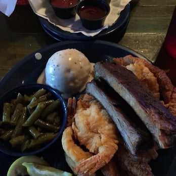 Cherry Creek Catfish - Cherry creek trio: ribs, catfish fillet, and fried shrimp on a bed of seasoned fries with mashed potatoes and green beans. - Seafood Near Me - Austin, Texas