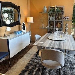 Drews Furniture - Porcelain Dining table with upholstered dining chairs. Accented with a lacquer white buffet and mirrored etagere by Johnston Casual.