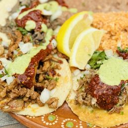Carnitas, beef, and al pastor tacos. Carnitas, beef, and al pastor tacos.