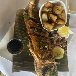 Fried red snapper and potatoes. Fried red snapper and potatoes.