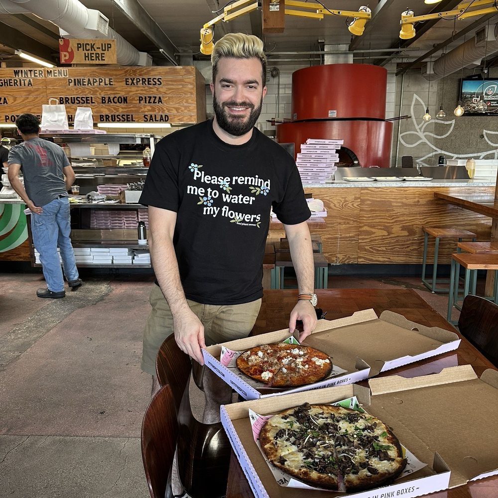 In the store with two gluten free pizzas In the store with two gluten free pizzas