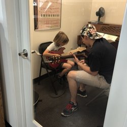 The Music Store - Evan D. teaching guitar.