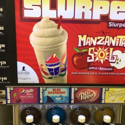 7-Eleven - One of two slurpee machines. There are eight flavors. My favorite Dr Pepper was out so I settled for Coca Cola.