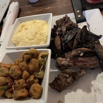 C Level - 16oz ribeye "medium" w/ portobello mushrooms  Fried Okra & Fontina Cheese grits. - Bars Near Me - Panama City Beach, Florida