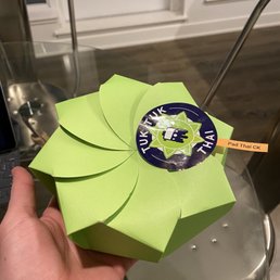 a person holding a green box a person holding a green box