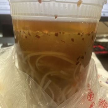 Pho 90 - Do you see the thick layer of oil. The chili flakes are not raising to the top because the layer is blocking it. - Vietnamese Near Me - Las Vegas, Nevada Pho 90 - Do you see the thick layer of oil. The chili flakes are not raising to the top because the layer is blocking it. - Vietnamese Near Me - Las Vegas, Nevada