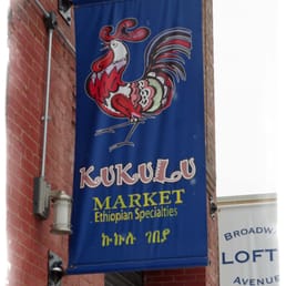 a blue sign with a rooster on it