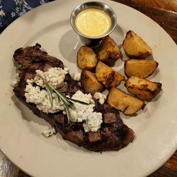 Black Bart's Steakhouse - NY Strip steak with blue cheese crumbles and roasted potatoes. - Steakhouses Near Me - Flagstaff, Arizona Black Bart's Steakhouse - NY Strip steak with blue cheese crumbles and roasted potatoes. - Steakhouses Near Me - Flagstaff, Arizona