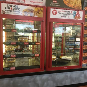 Kum & Go - a display of pizzas in a store - Convenience Stores Near Me - Ames, Iowa Kum & Go - a display of pizzas in a store - Convenience Stores Near Me - Ames, Iowa